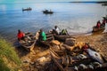 fishermen and fishing boats with fish on the counter on Lake Tanganyika