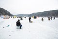 Fishermen fishing on a frozen lake in winter Royalty Free Stock Photo