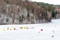 Fishermen fishing on a frozen lake in winter Royalty Free Stock Photo