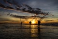 Fishermen fishing in the sea at sunrise Royalty Free Stock Photo