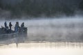 Fishermen fishing from a small dock in the morning mist on Spruce Knob Lake in West Virginia Royalty Free Stock Photo