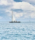 Fishermen fishing on a white sailboat Royalty Free Stock Photo