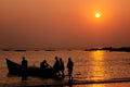 Fishermen going to fishing on a boat in the sea at sunset, Goa, India. Royalty Free Stock Photo