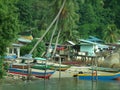 Fishermen houses and fishing boats and pirogues in Pulau Pangkor, Malaysia