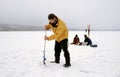 Fishermen ice fishing on a frozen lake in Norway Royalty Free Stock Photo