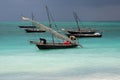 Fishermen in the Indian Ocean are folded sail on a boat before the storm. A flotilla of traditional fishing boats, dhow on the wav