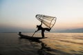 Fishermen in Inle lakes sunset, Myanmar. Royalty Free Stock Photo