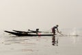 Fishermen in Inle lakes sunset, Myanmar. Royalty Free Stock Photo