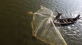 Fishermen on Irrawaddy river throwing fishing nets