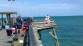 Fishermen on Kure Beach Pier on east coast North Carolina