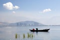 Fishermen on Lake in front of City