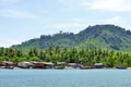 Fishermen long tail boats and houses at Mook island