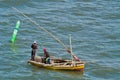 Fishermen and nets in dhow