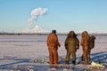 Fishermen observe the eruption of the volcano Sheveluch.