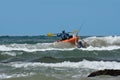 Fishermen With Ocean Kayak In The Waves