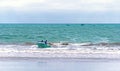 Fishermen in the ocean returning to land