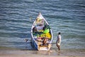 Fishermen parking their small fishing boat after a good catch of fish in the night Royalty Free Stock Photo