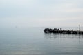 Fishermen on the pier fishing. Black Sea. Crimea. Royalty Free Stock Photo