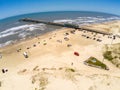 Fishermen pier, sand and waves Royalty Free Stock Photo