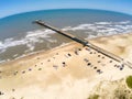 Fishermen pier, sand and waves Royalty Free Stock Photo