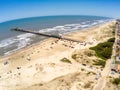 Fishermen pier, sand and waves Royalty Free Stock Photo