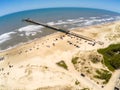 Fishermen pier, sand and waves Royalty Free Stock Photo