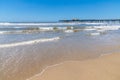 Fishermen pier, sand and waves Royalty Free Stock Photo