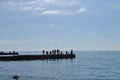 fishermen on the pier and sea Royalty Free Stock Photo