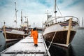 Fishermen are preparating the ships for fishing in severe north