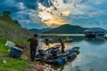 The fishermen prepare the fishing equipment before night fishing routine