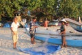 Fishermen preparing fish nets at sunset.