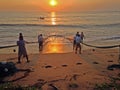 Fishermen pull the net out of the Indian Ocean