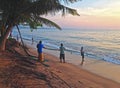 Fishermen pull the net out of the Indian Ocean