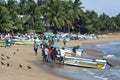 Fishermen pull their boat from the ocean onto Arugam Bay beach in Sri Lanka.