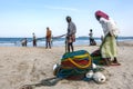 Fishermen pull in their fishing nets on the beach at Uppuveli in Sri Lanka.