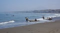 Fishermen on reed boats, Huanchaco,Peru Royalty Free Stock Photo