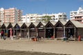 Fishermen relaxing in their beachfront huts in the Algarve resort of Monte Gordo, Portugal