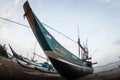 Fishermen remove fish from fishing nets at the beach