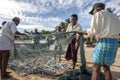 Fishermen remove their catch from their nets on Arugam Bay beach in Sri Lanka.