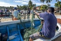 Fishermen remove their catch from their nets on Arugam Bay beach in Sri Lanka.