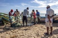 Fishermen remove their catch from their nets on Arugam Bay beach in Sri Lanka.