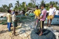 Fishermen remove their catch from their nets on Arugam Bay beach in Sri Lanka.