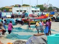 Fishermen repairing fishing nets Royapuram harbour Chennai Tamil Nadu India