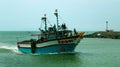 The fishermen return from the sea with big boat. Royalty Free Stock Photo