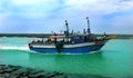 The fishermen return from the sea with big boat. Royalty Free Stock Photo