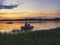 Fishermen returning to shore in rowing boat