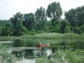 Fishermen on the river Danube. Fishing from the small boat in the late afternoon. Royalty Free Stock Photo