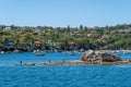 Fishermen on a rock in the bay of Sydney, Australia