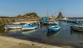 Fishermen`s boats against a background of Isole dei Ciclopi at Aci Trezza, Sicily