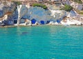 Fishermen`s huts carved into the rocky coast of Kimolos Island